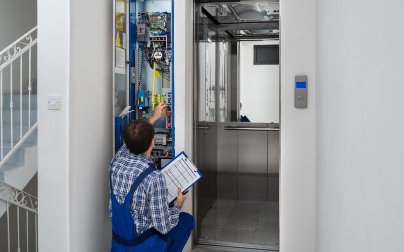 Technician Repairing Elevator