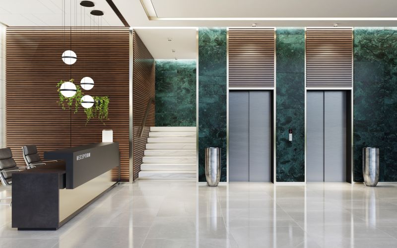 Modern Offices lobby interior area with elevators and stairs and with long reception desk